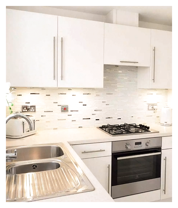 white dominant kitchen with under cabinet lights in natural white light